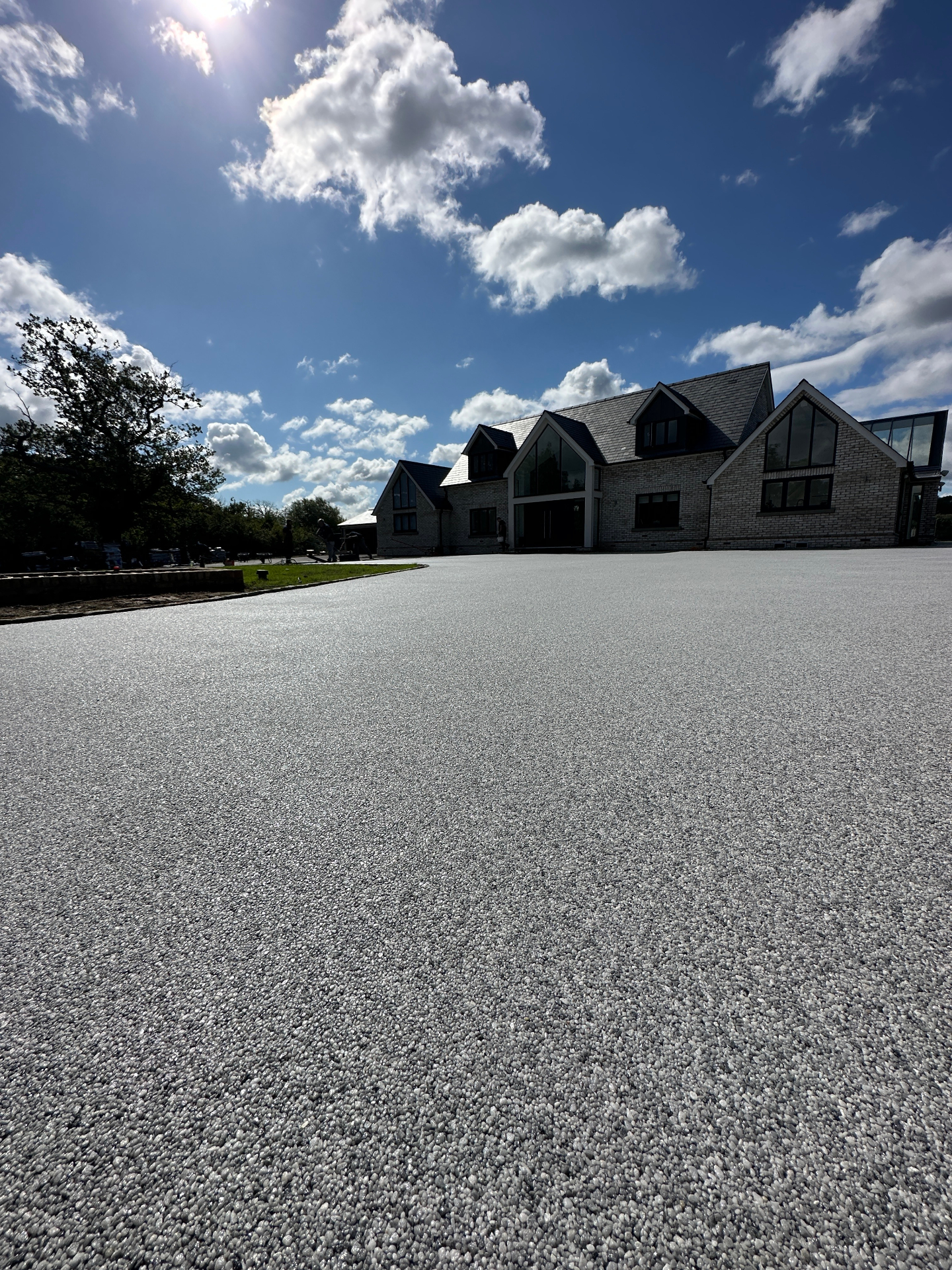 Driveway with vehicle parked, showing scale and durability