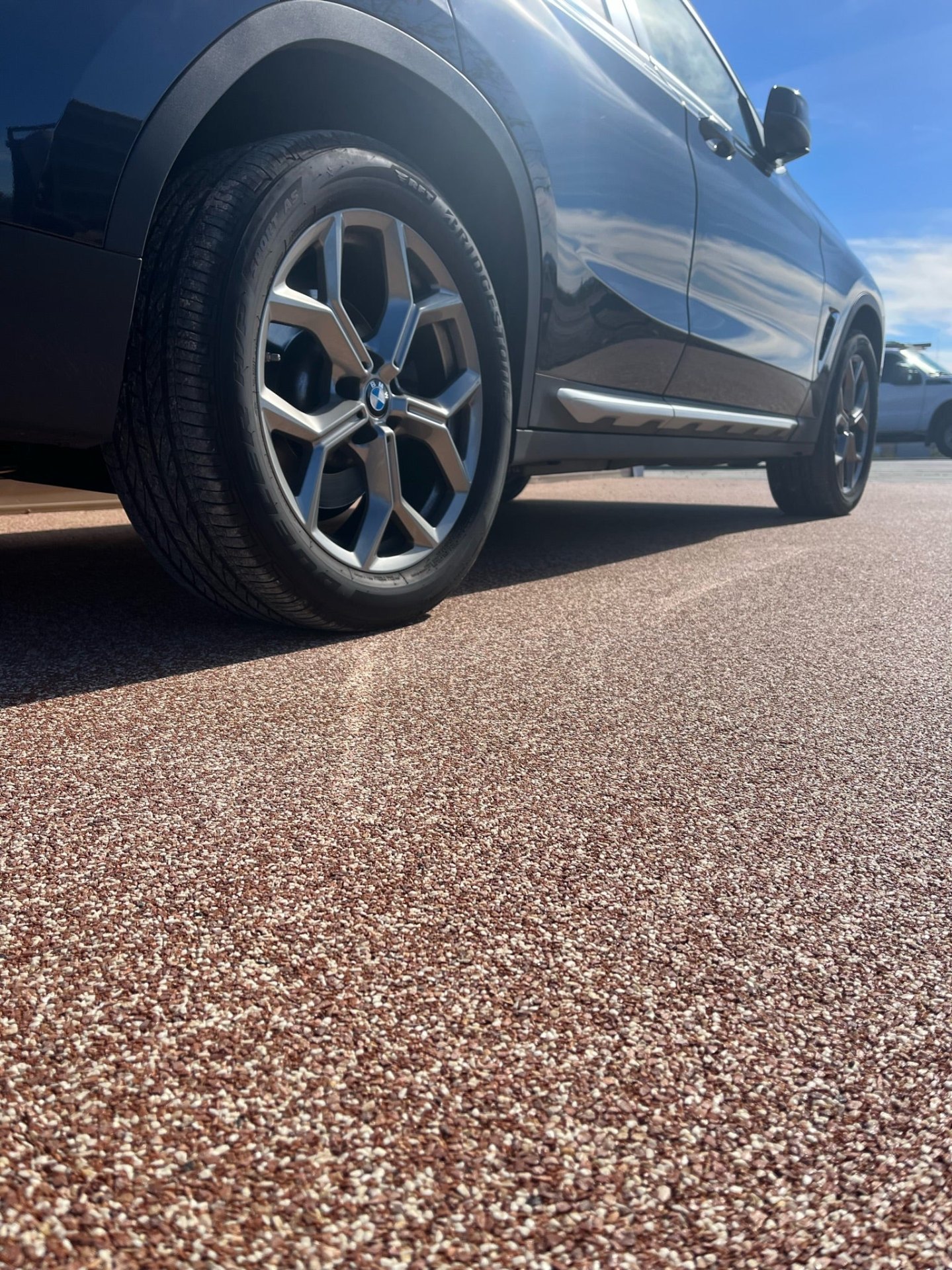 Close-up of natural stone aggregate driveway finish