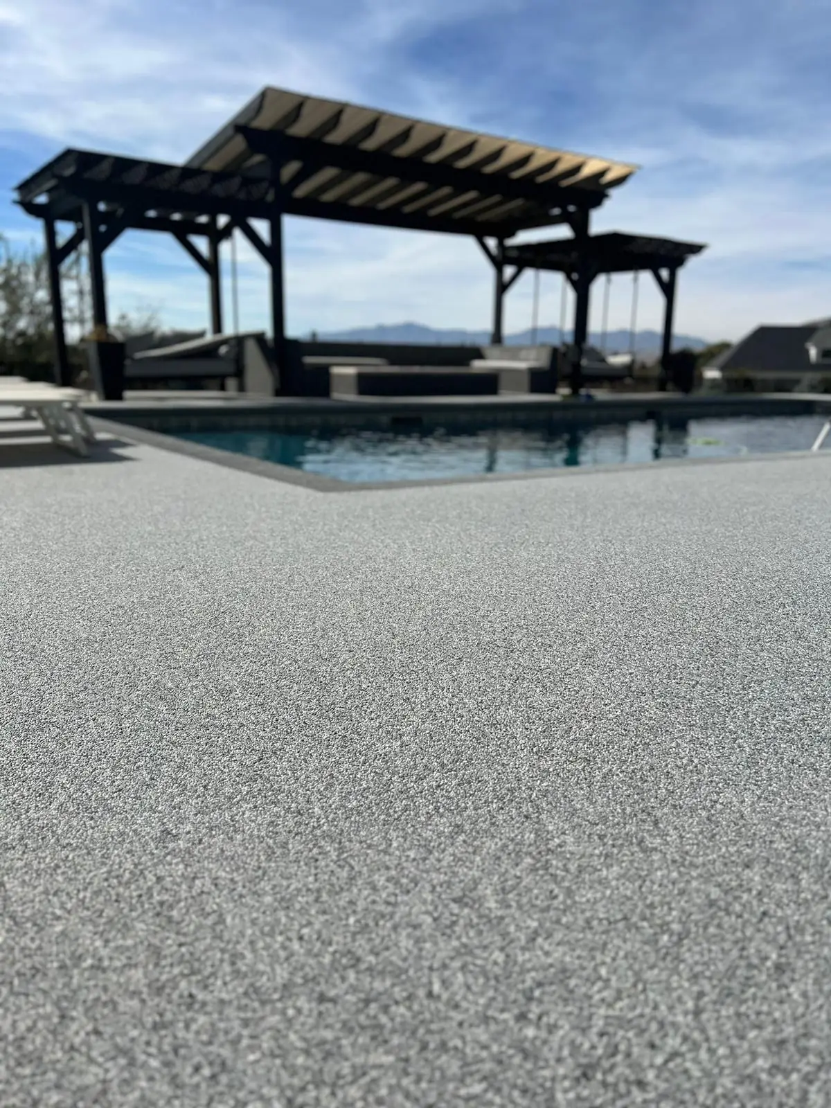Wide shot of finished pool deck installation