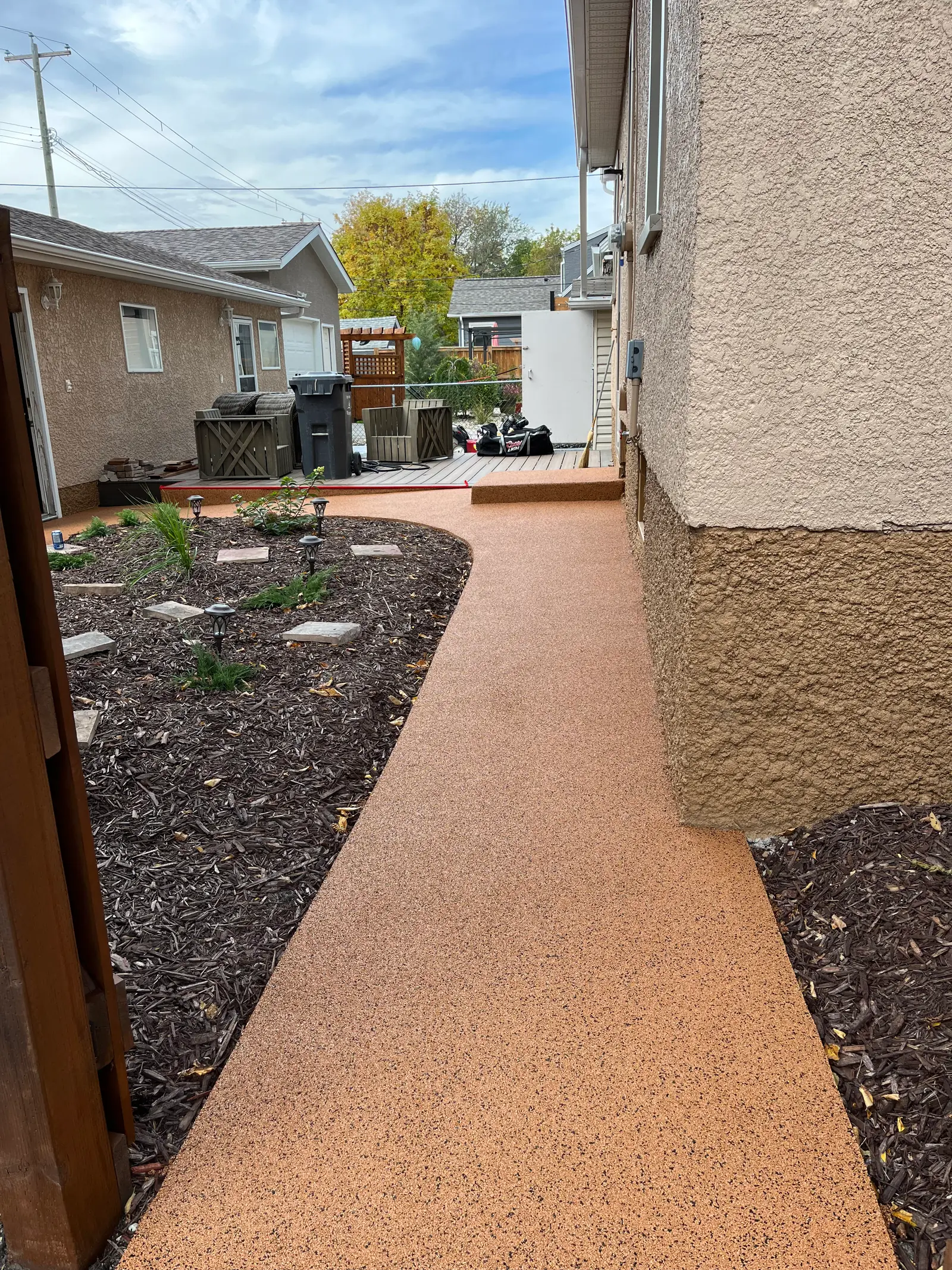 Backyard walkway through landscaping